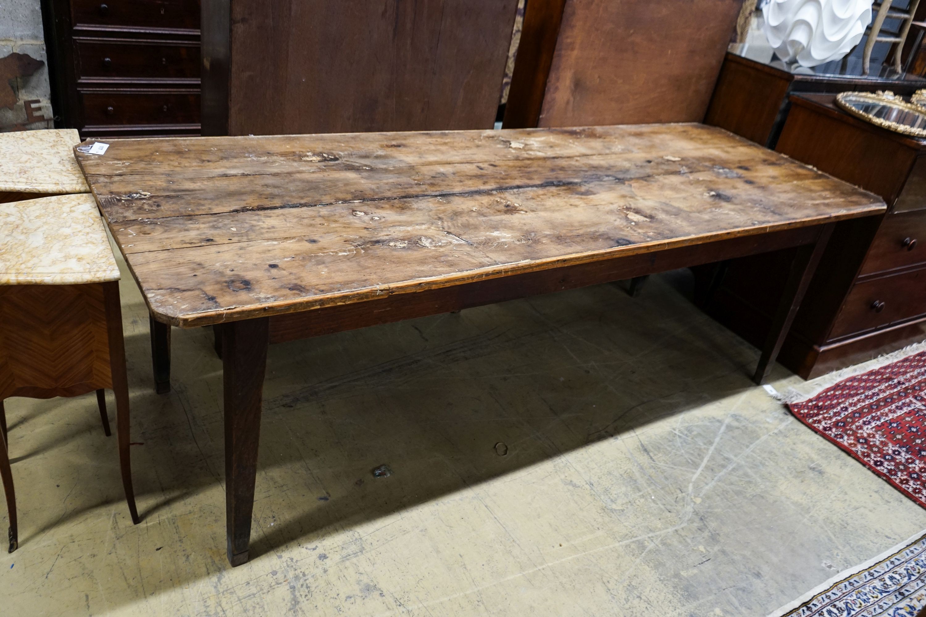 An early 19th century French provincial oak farmhouse table, length 243cm, depth 87cm, height 78cm